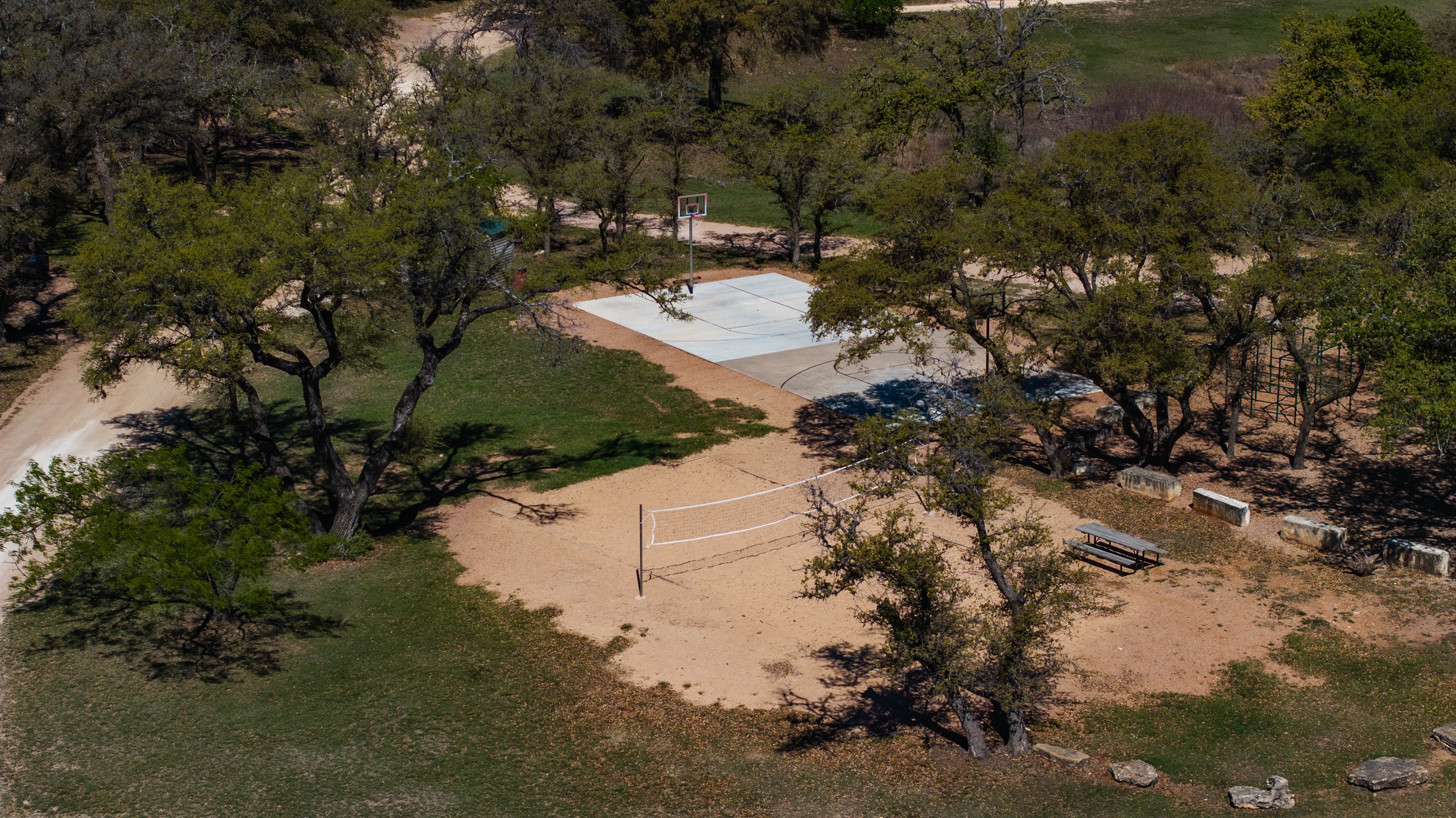 Point Venture Park offers a basketball court and a sand volleyball court.