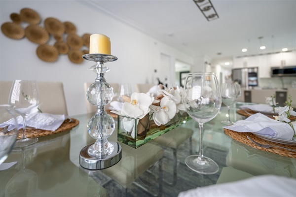 Modern glass dining table in open-concept layout