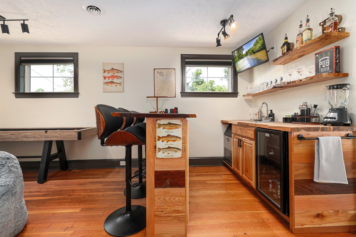 Full Bar with seating, ice machine, sink, refrigerator, bar ware, glasses