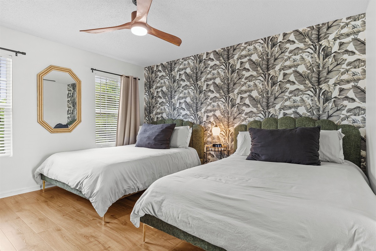 Also located on the top floor, the secondary Bedroom offering 2 queen size beds