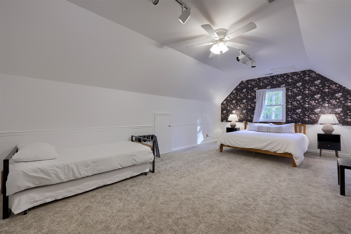 King Bed with twin trundle; above garage