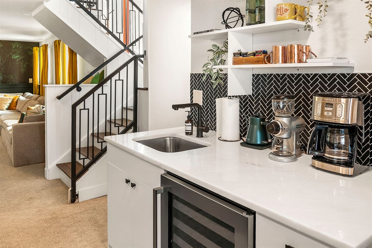 Coffee lovers, rejoice! With a Keurig, pour-over, French press, burr grinder, and gooseneck kettle plus mugs and a wine fridge your coffee, tea, and BYOB bar is perfect for entertaining.