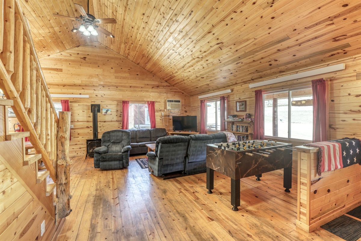 Living area with fireplace and Babyfoot