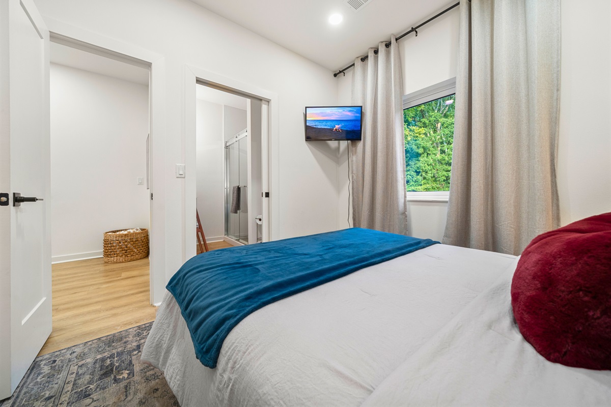 Additional view of the queen bedroom with en-suite access and plenty of natural light.