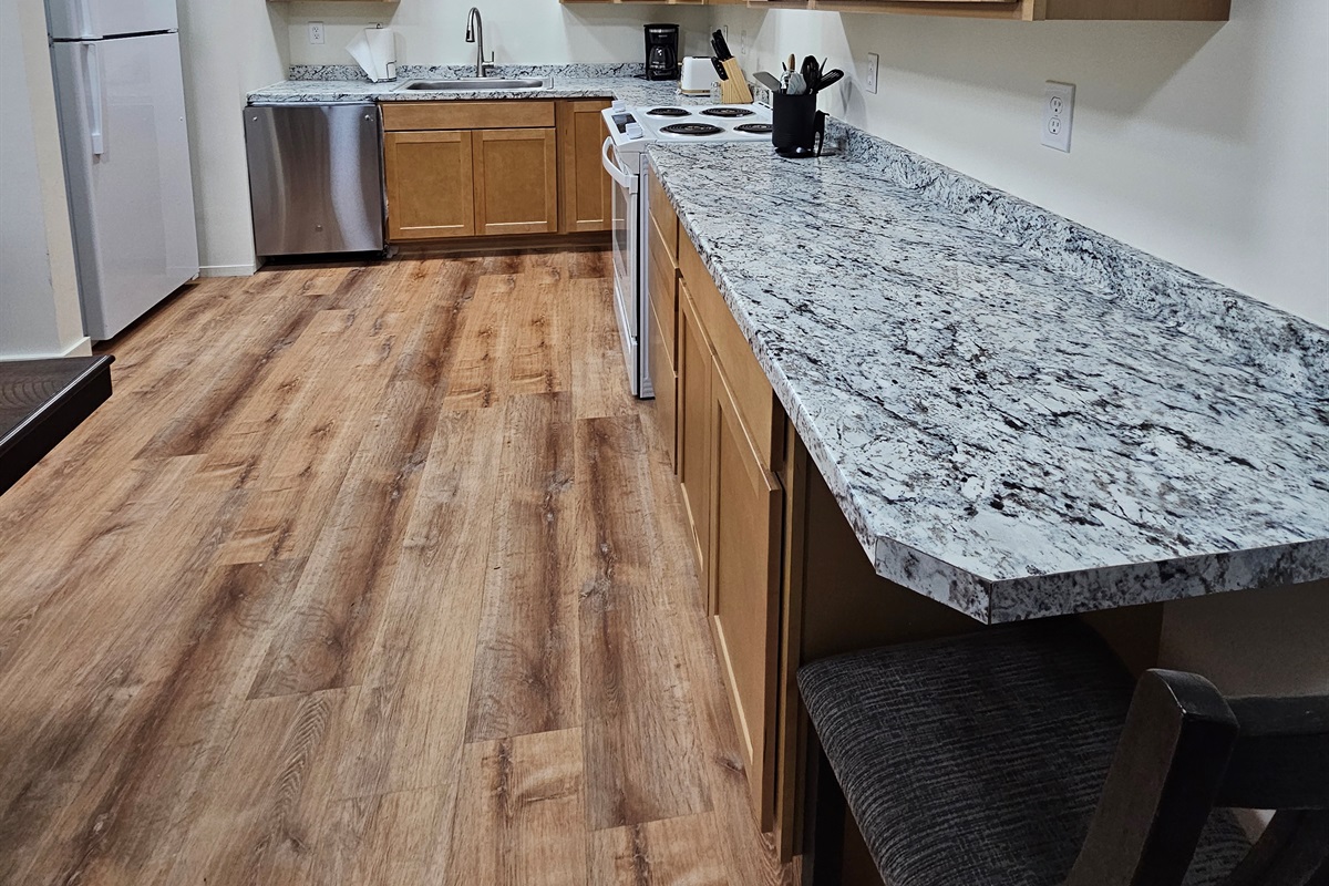 Full Kitchen with Dishwasher, Stove, and Refrigerator