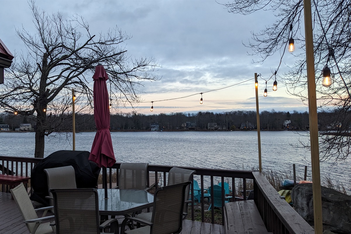Sunset Lakefront Views from the deck enhanced with string lights