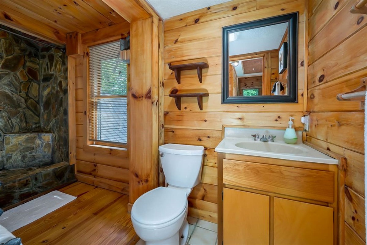 Upstairs full bath wit hand crafted stone -spa walk in shower. Door to bath in master bedroom and in hallway.