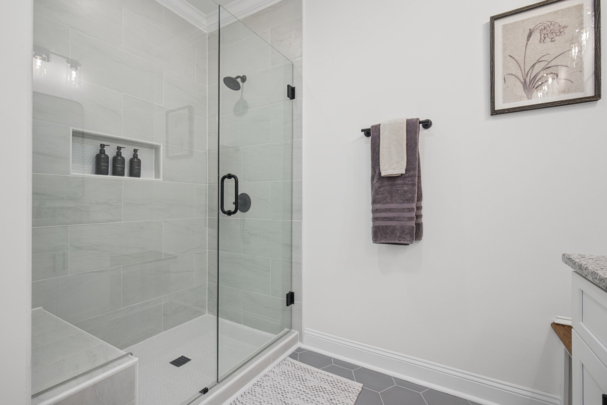Spa-style walk-in shower with built-in bench seating