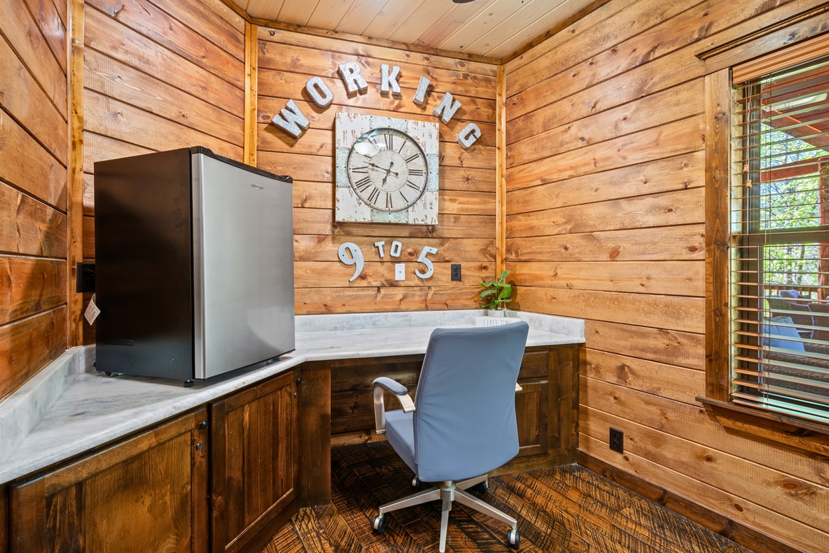 A dedicated workspace provides a quiet corner to catch up on emails or work remotely while still enjoying the cabin setting.