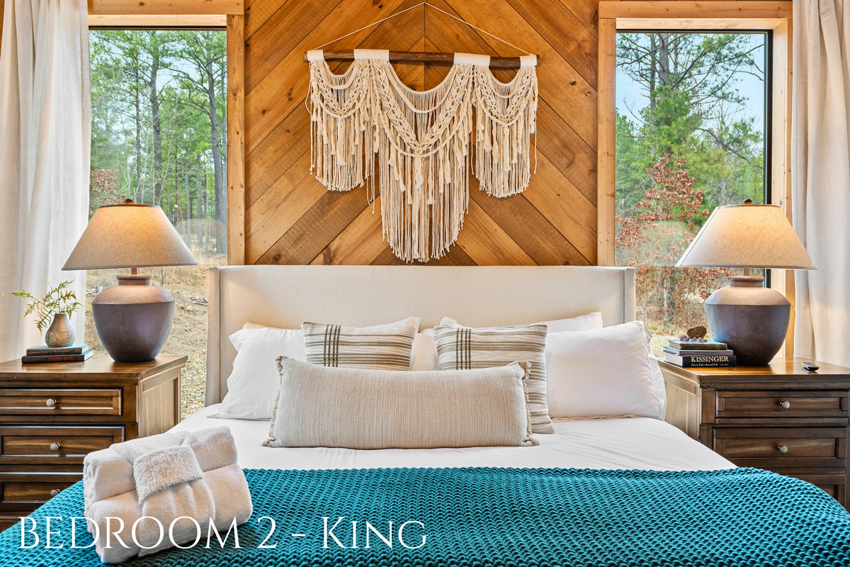 Snuggle up in comfort with nature as your backdrop! This king-sized haven combines rustic charm with plush comfort, perfect for dreamy nights and lazy mornings.