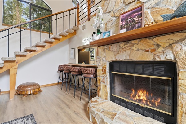 Stone fireplace with electric logs