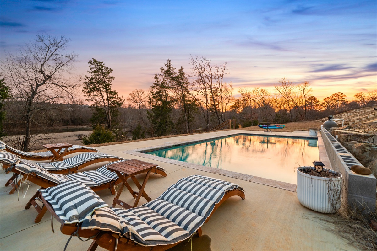 Lounge chairs by the pool create the perfect setup for soaking up the sun or relaxing with a good book.