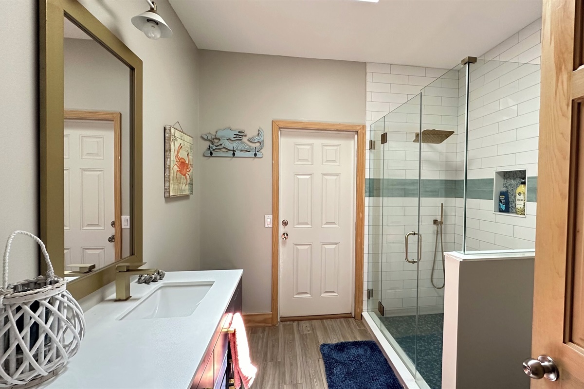 Hall bath leads directly to deck and in from the sandy beach