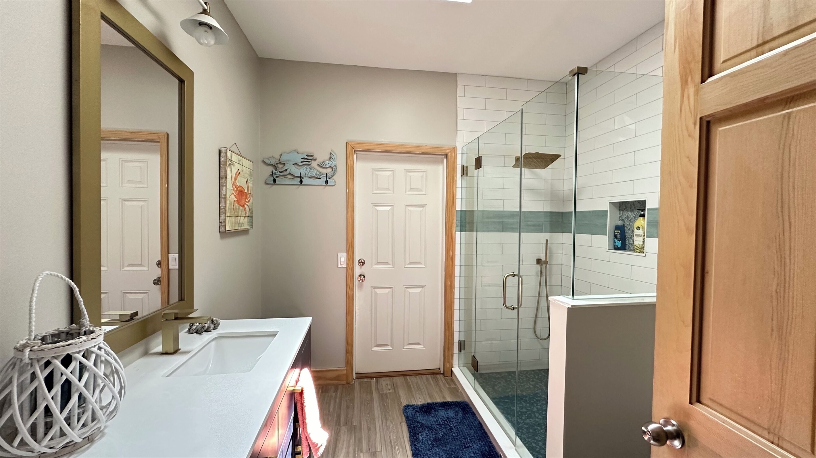 Hall bath leads directly to deck and in from the sandy beach