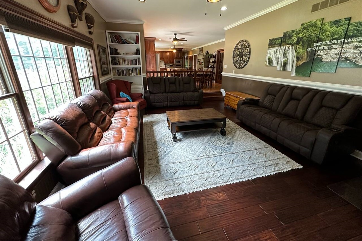 Large Open Family room  (16ft x 24ft) with 10 ft ceiling (view from the fireplace). The wide-open design enables you to see family in the nook and large kitchen.
