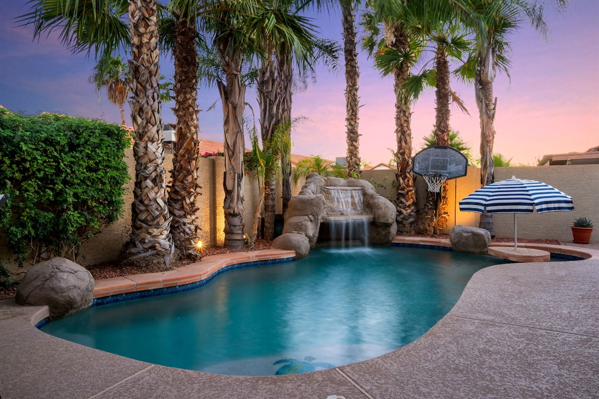 A resort style luxury heated pool right in your own private backyard.Featuring a Grotto with waterfall, tiki bar, and pool basketball