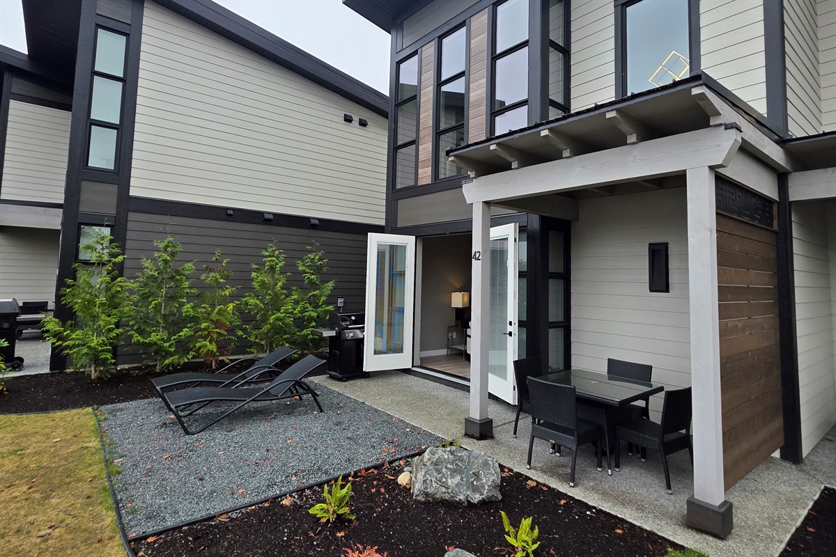 Back patio view. BBQ. Double glass doors.