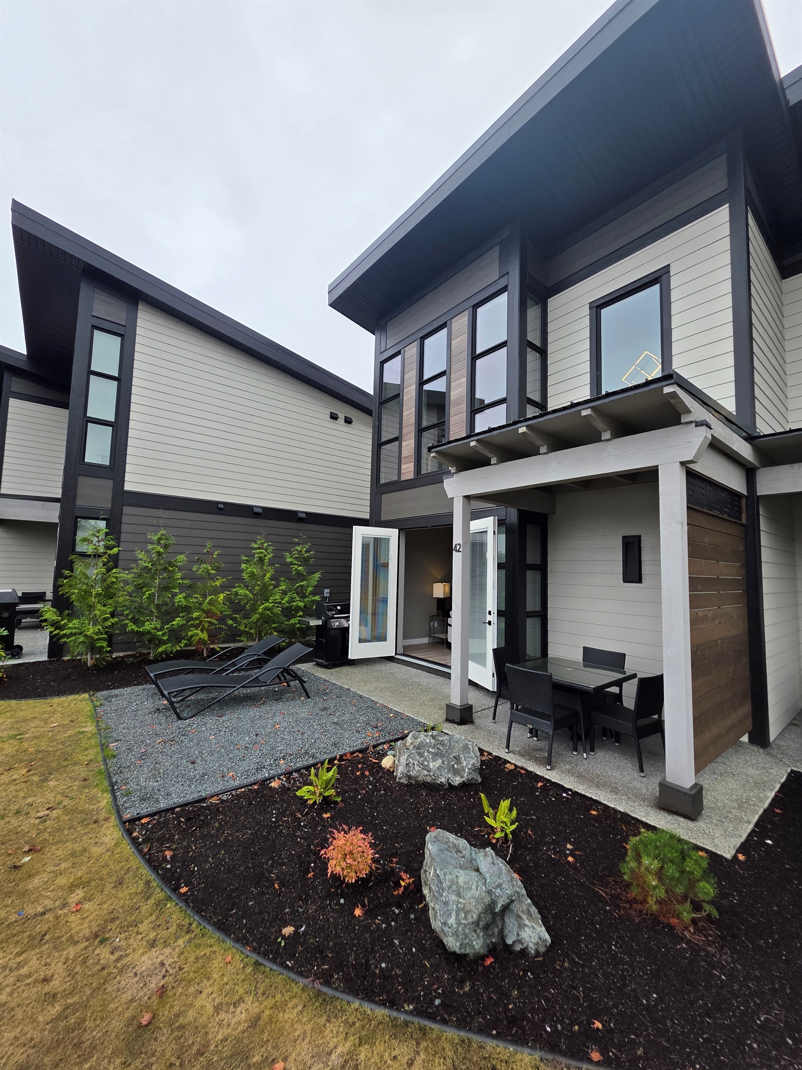 Back patio view. BBQ. Double glass doors.