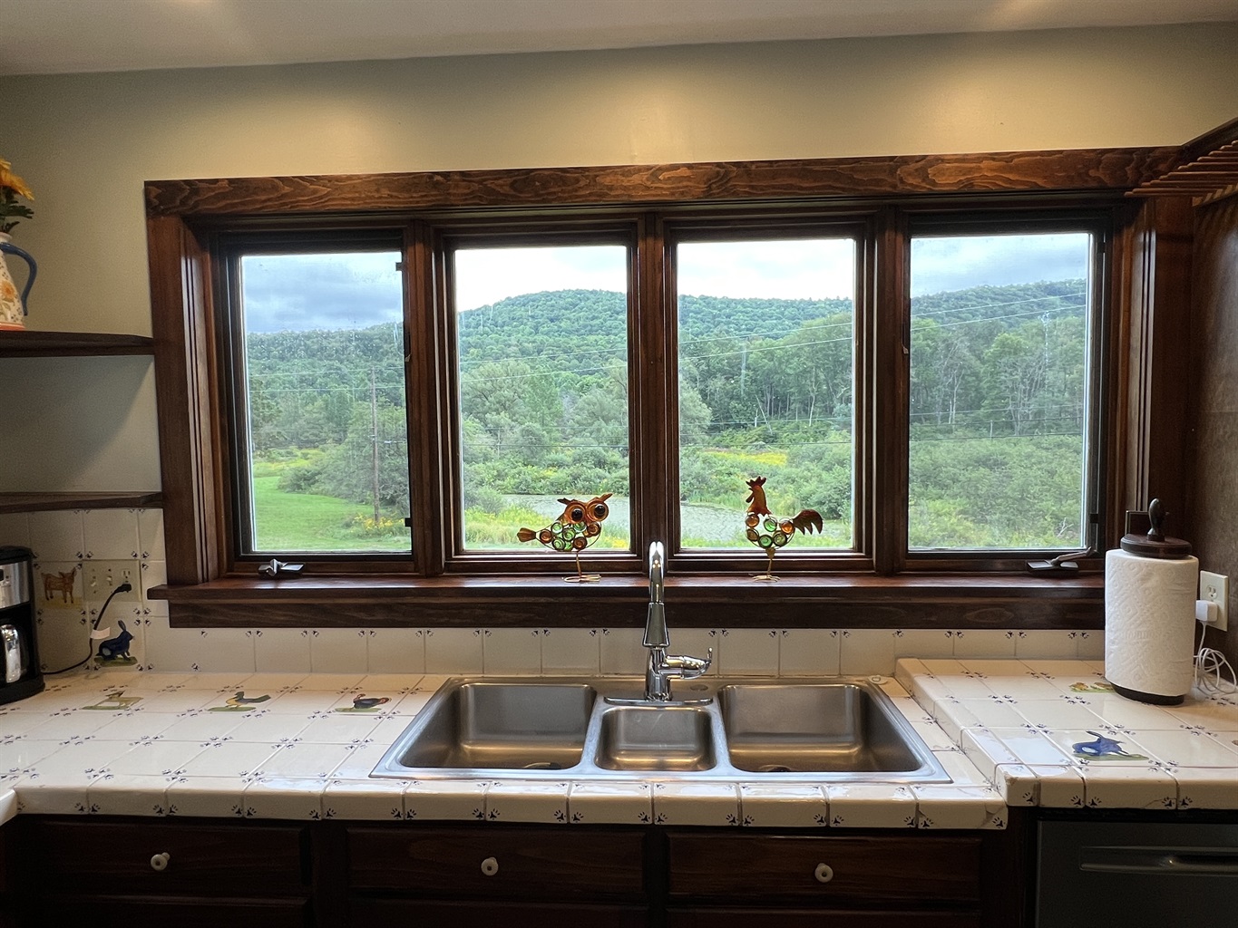 Cloverleaf Farm view of the private pond andred creek rolling hills right from the kitchen window.
