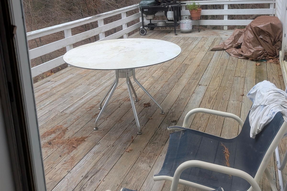 Private outdoor deck with seating and grill—perfect for relaxing, dining, or enjoying fresh mountain air.