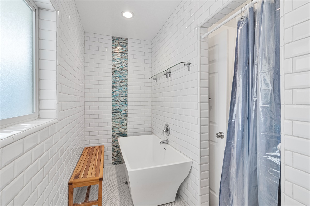 Don't worry about your little kids splashing in the tub here! This bathroom was designed with this in mind.
