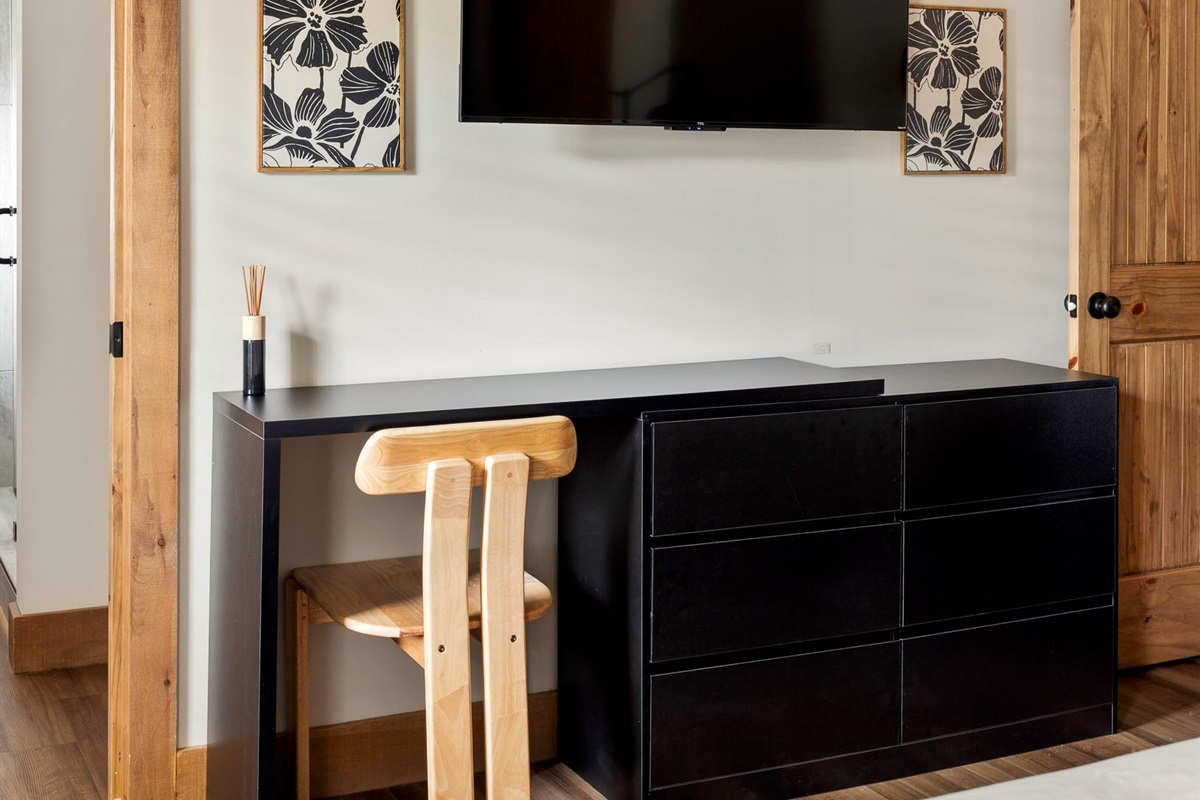 A dedicated desk space within the suite, perfect for a quiet moment of focus, if inspiration strikes.