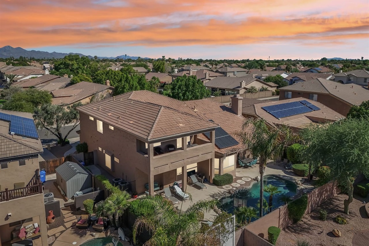 This elevated view shows the full outdoor living experience—from pool to patio—all glowing under Scottsdale’s vibrant skies.