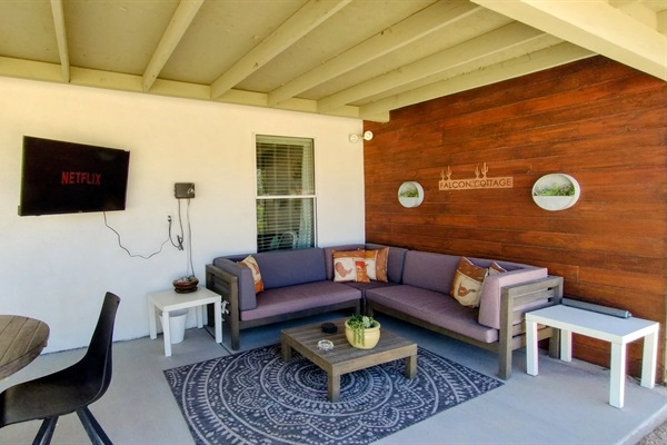Outdoor seating area with relaxing sectional and smart TV. Perfectly set up for a relaxing evening grilling and spending time together. The TV mount can pivot to enjoy from either side of the patio