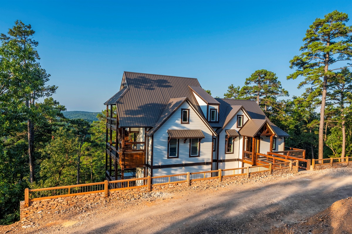 Stunning luxury cabin exterior surrounded by peaceful mountain landscapes
