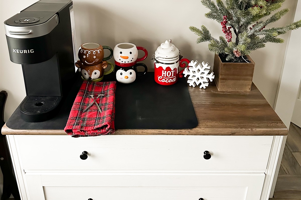 A cozy upstairs coffee nook. Start your morning with a fresh cup from the Keurig in a festive mugs. Perfect for slow mornings and holiday vibes! 