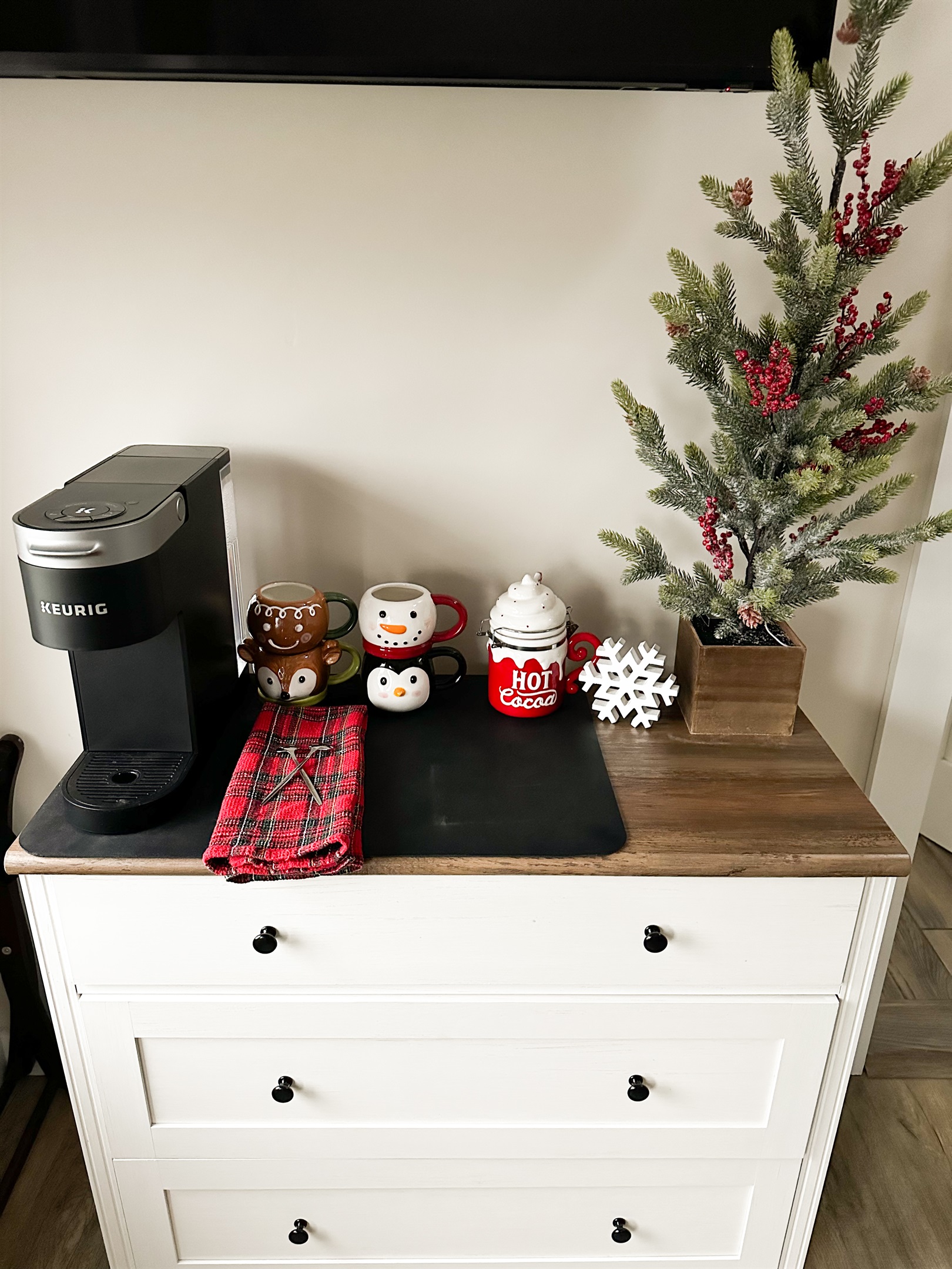 A cozy upstairs coffee nook. Start your morning with a fresh cup from the Keurig in a festive mugs. Perfect for slow mornings and holiday vibes! 