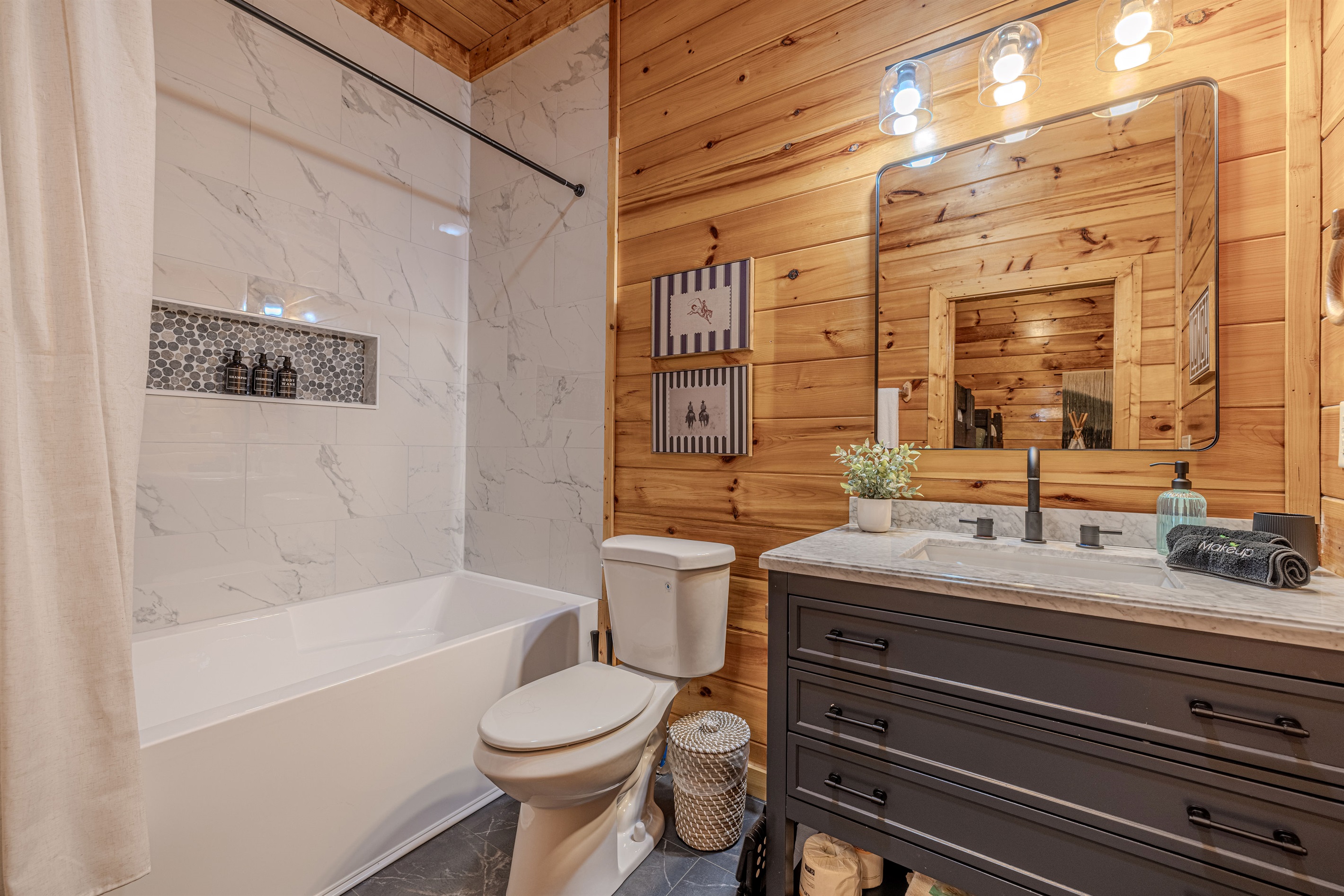 The connected bunk room has a full bath with a large tub