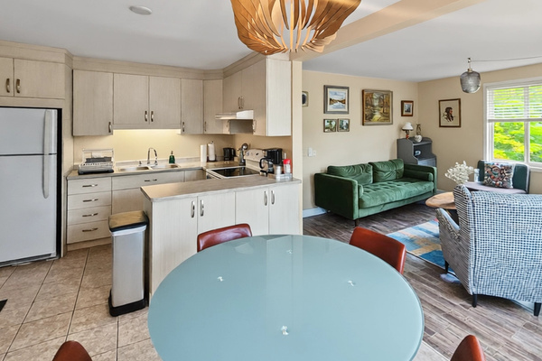 Dining area with views of kitchen and living room
