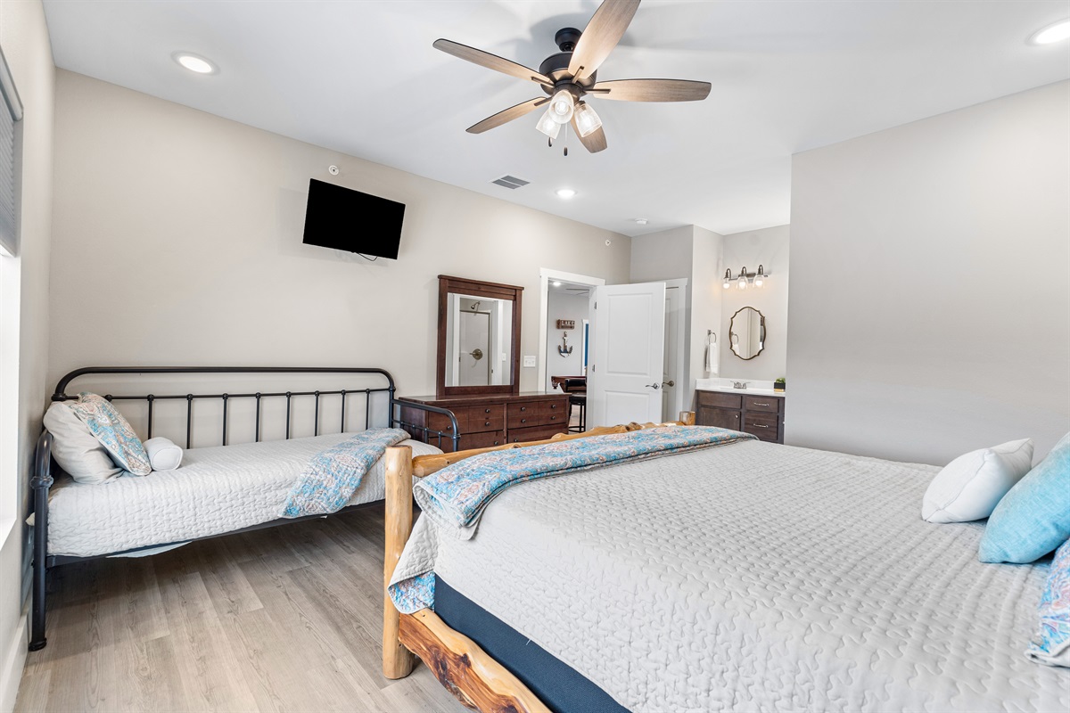 Upper level king bedroom 4 with twin bed and en suite shower