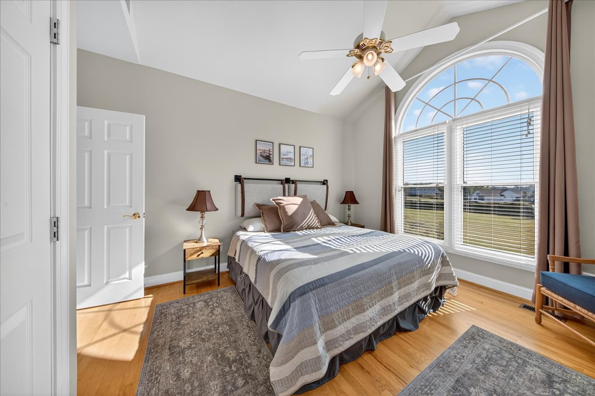 Peaceful bedroom retreat with bright natural light.