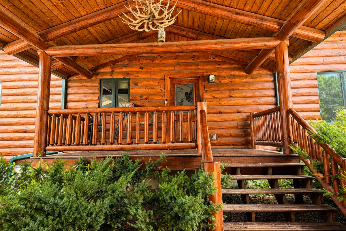 The covered entry porch adds a cozy cabin feel and creates a welcoming transition into the House.
