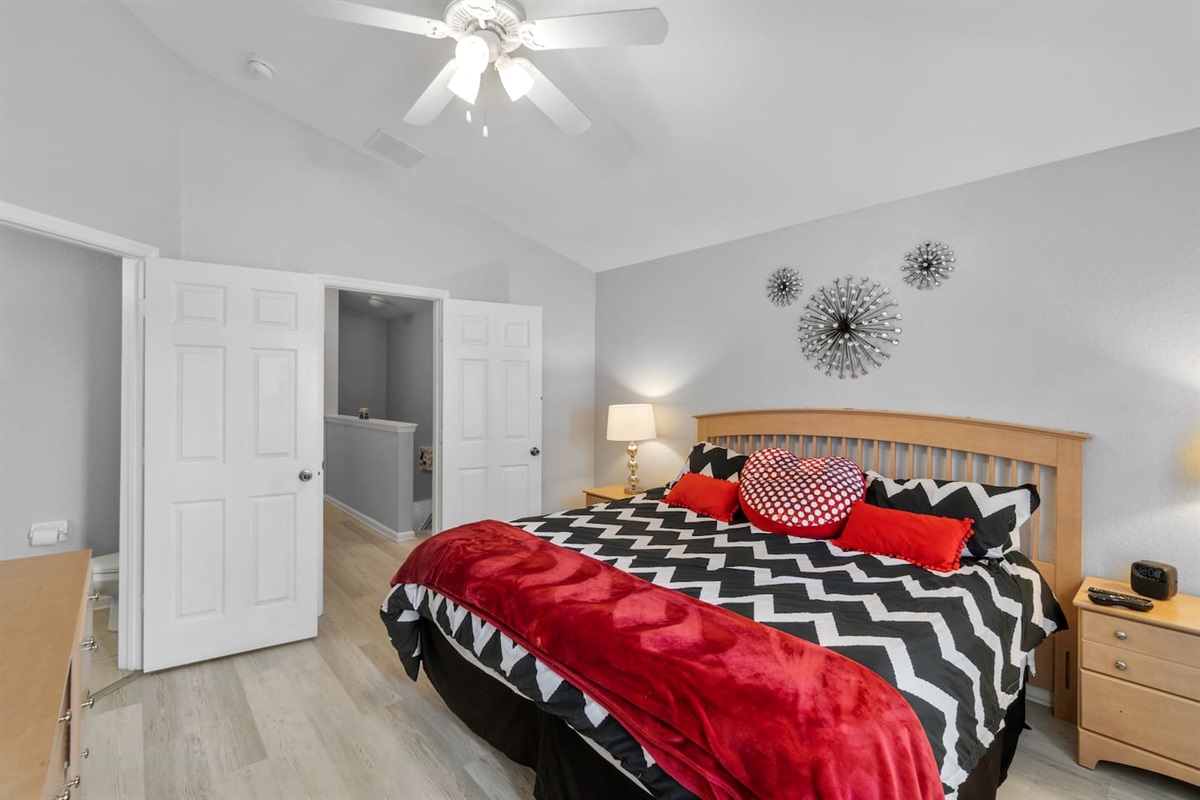 - Bright master bedroom with stylish bedding, decorative wall art, and cozy lighting  
- Plenty of space with double door entry leading to private ensuite bathroom  
- Inviting retreat for restful nights after days of exploring nearby attractions  
