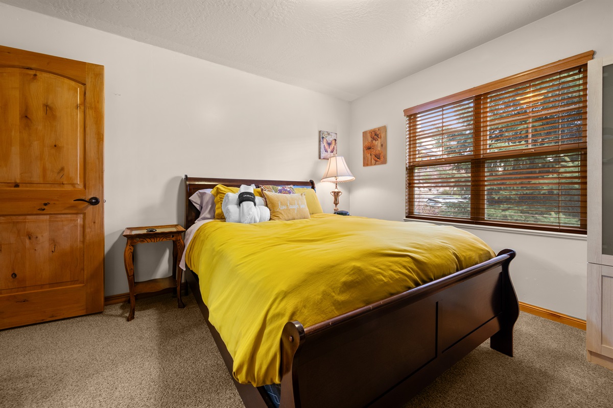 Bedroom 2 is designed for a peaceful night’s sleep. Lovely views out the large window.