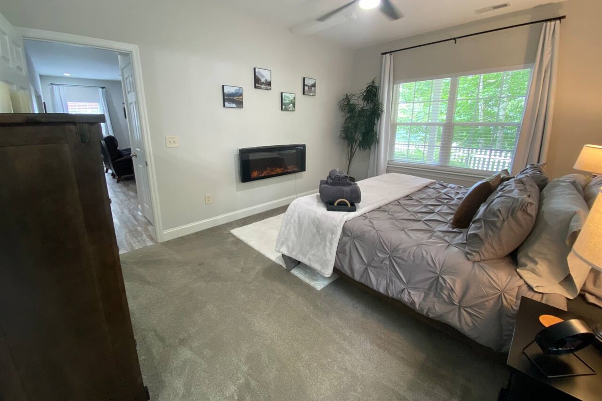 The master bedroom also features an electric fireplace to create that perfect ambiance for the mountain views from the large windows. 