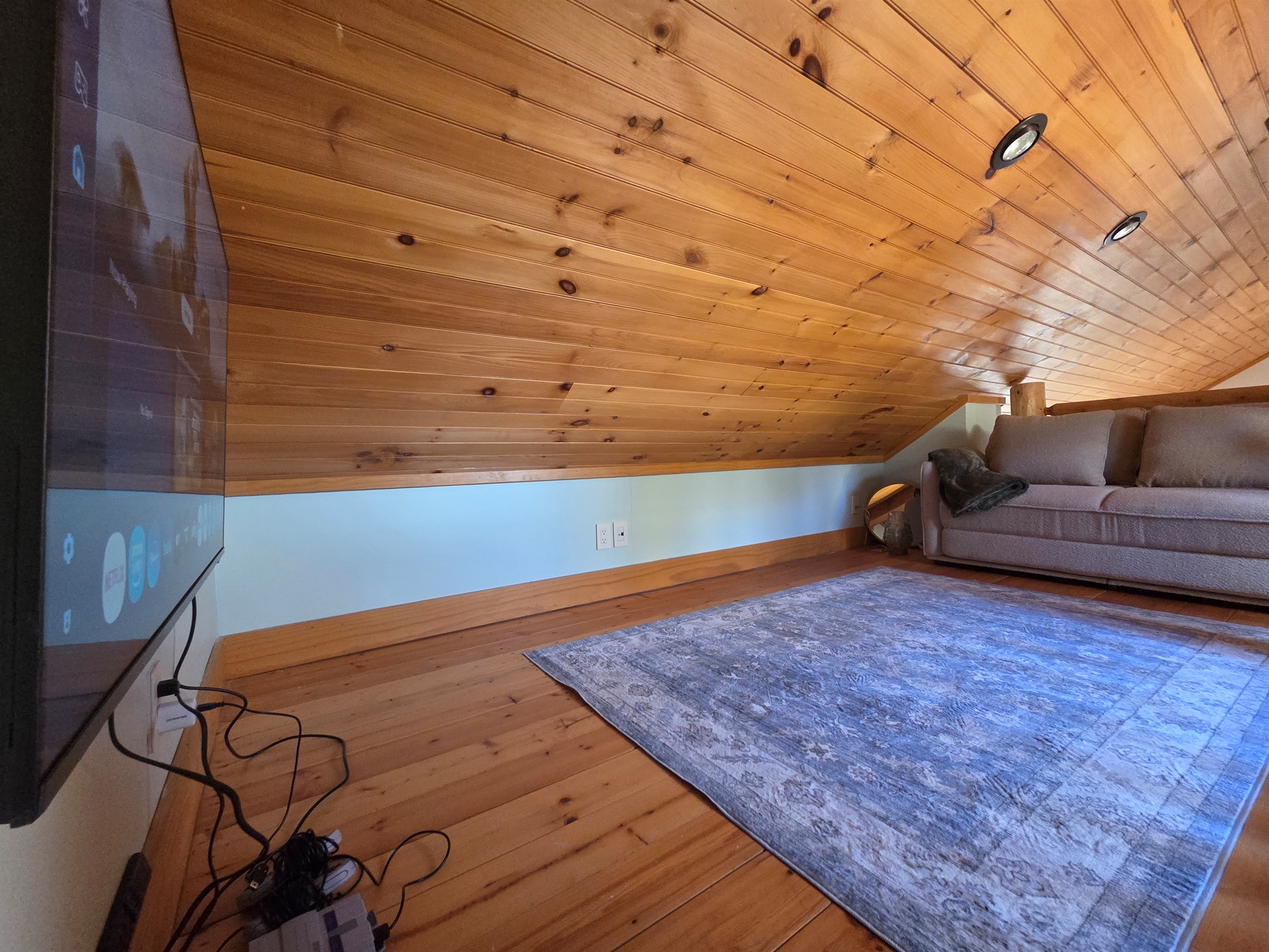 Kids (or adults!) can enjoy the loft above the carriage house bedroom, featuring a Smart TV with a gaming system—a cozy spot to relax, play games, or hang out apart from the main house