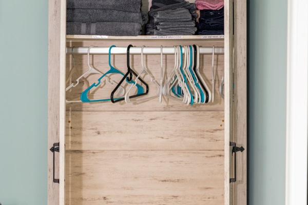 Primary bathroom clothes storage