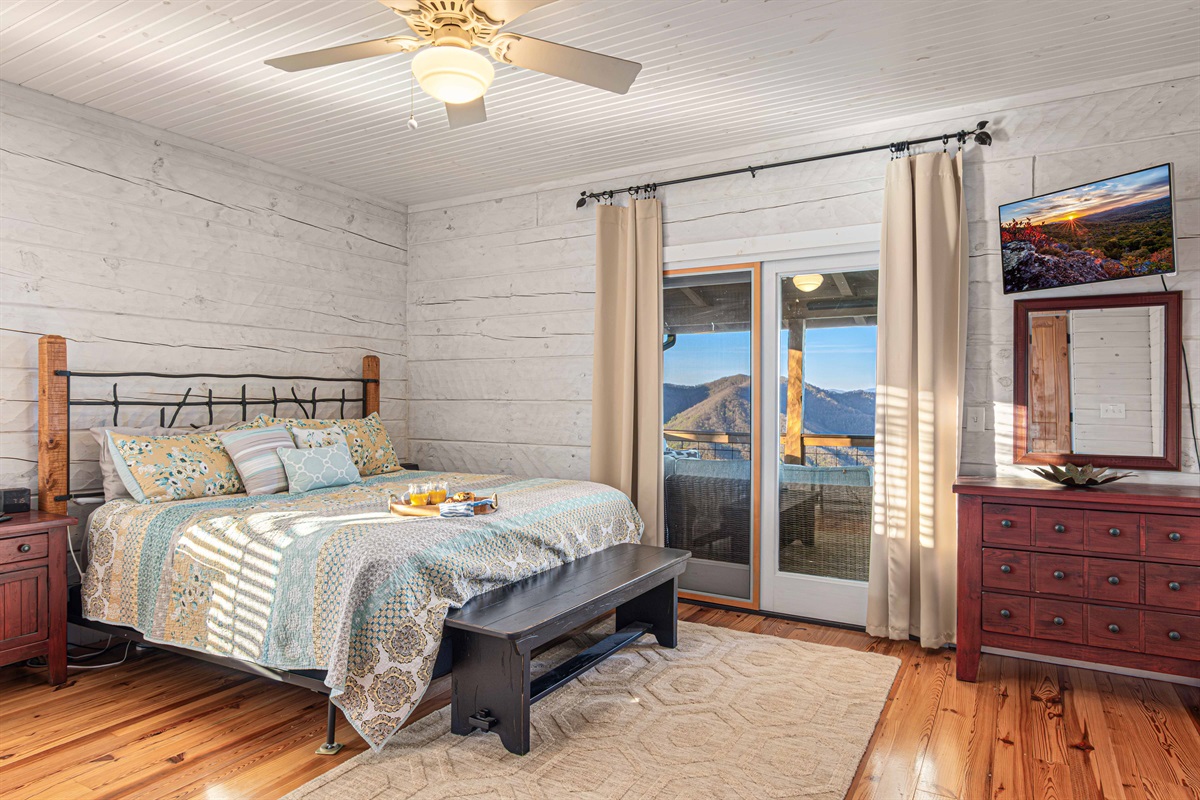 Main Level King Bedroom 2: Embrace mountain views from this inviting retreat with rustic charm and elegant decor!