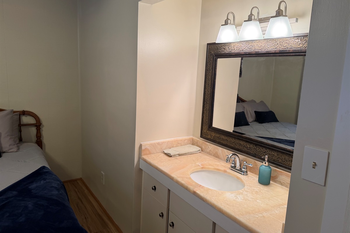 King bedroom with personal sink 