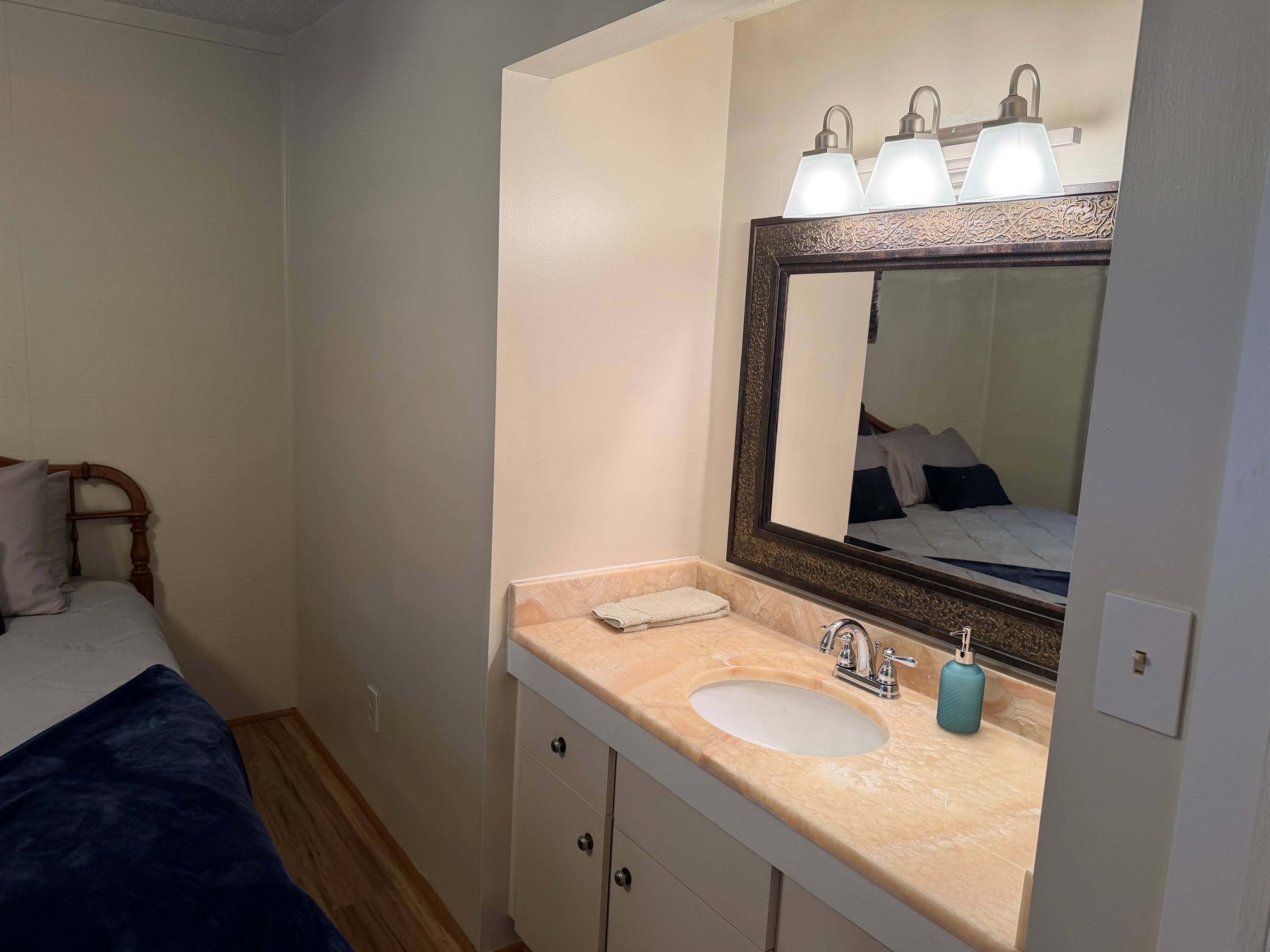 King bedroom with personal sink 