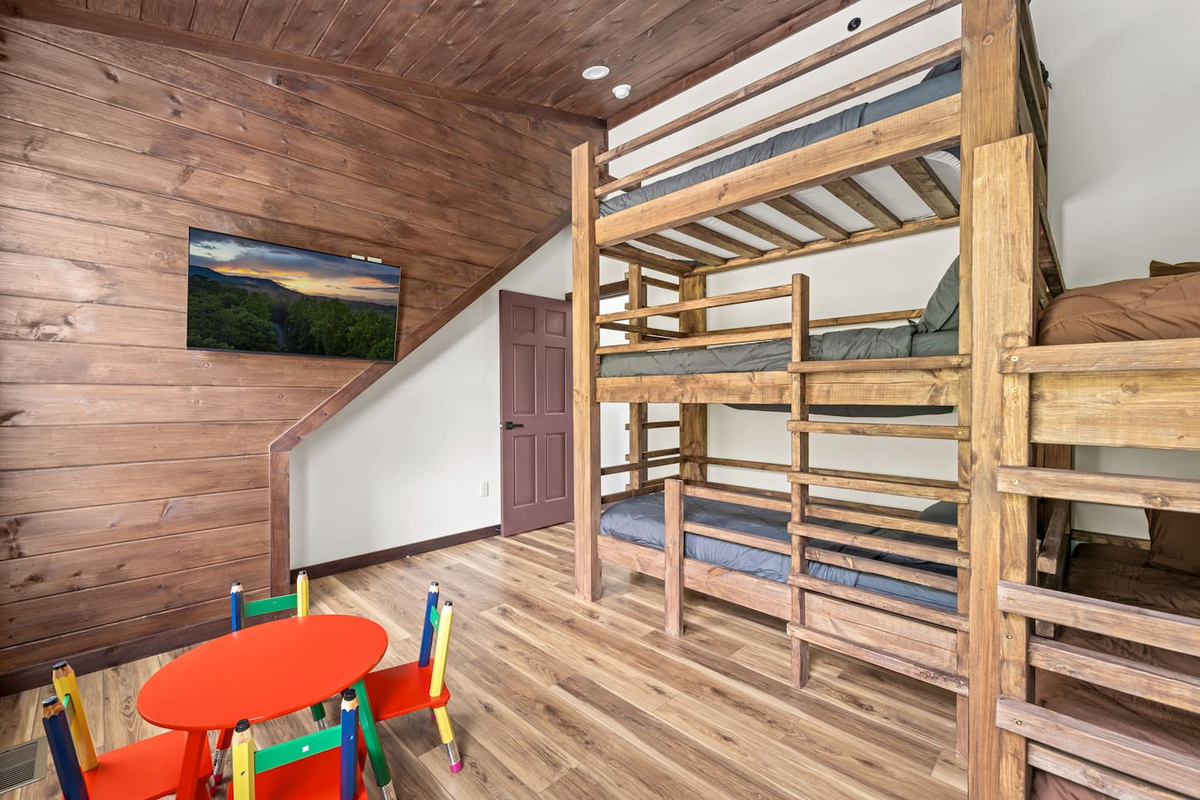 bunk bed room with kids table set 