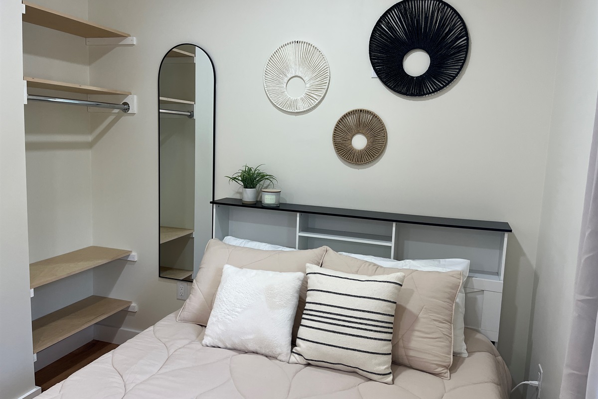 Queen bed and storage in sleeping area