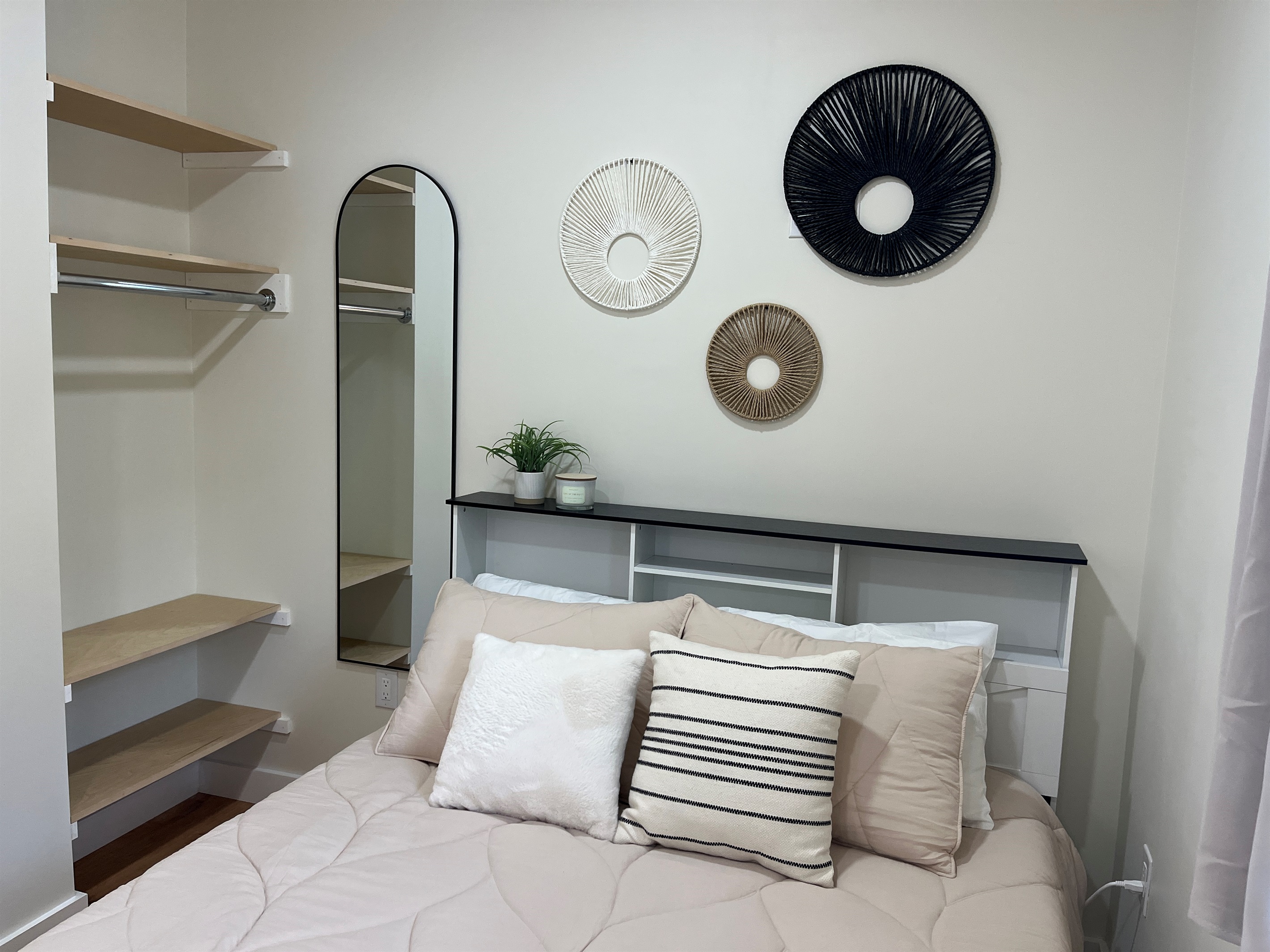 Queen bed and storage in sleeping area