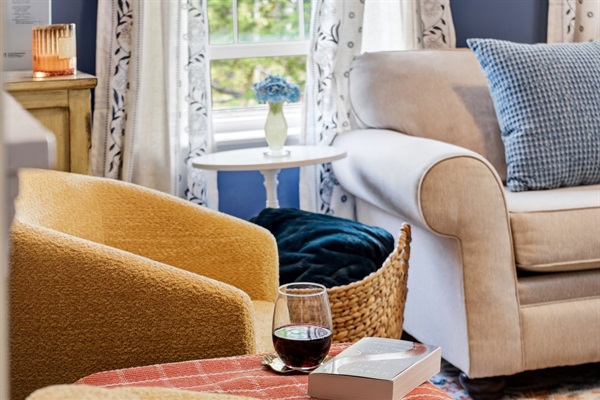 A cozy living room seating area perfect for unwinding, ideal for reading a good book or enjoying a glass of wine.