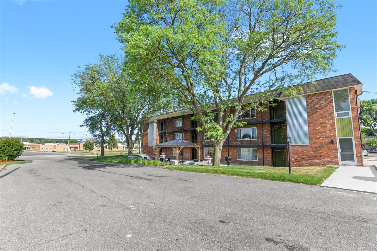 The welcoming front yard showcases manicured lawns and well-defined walkways for easy access and curb appeal.