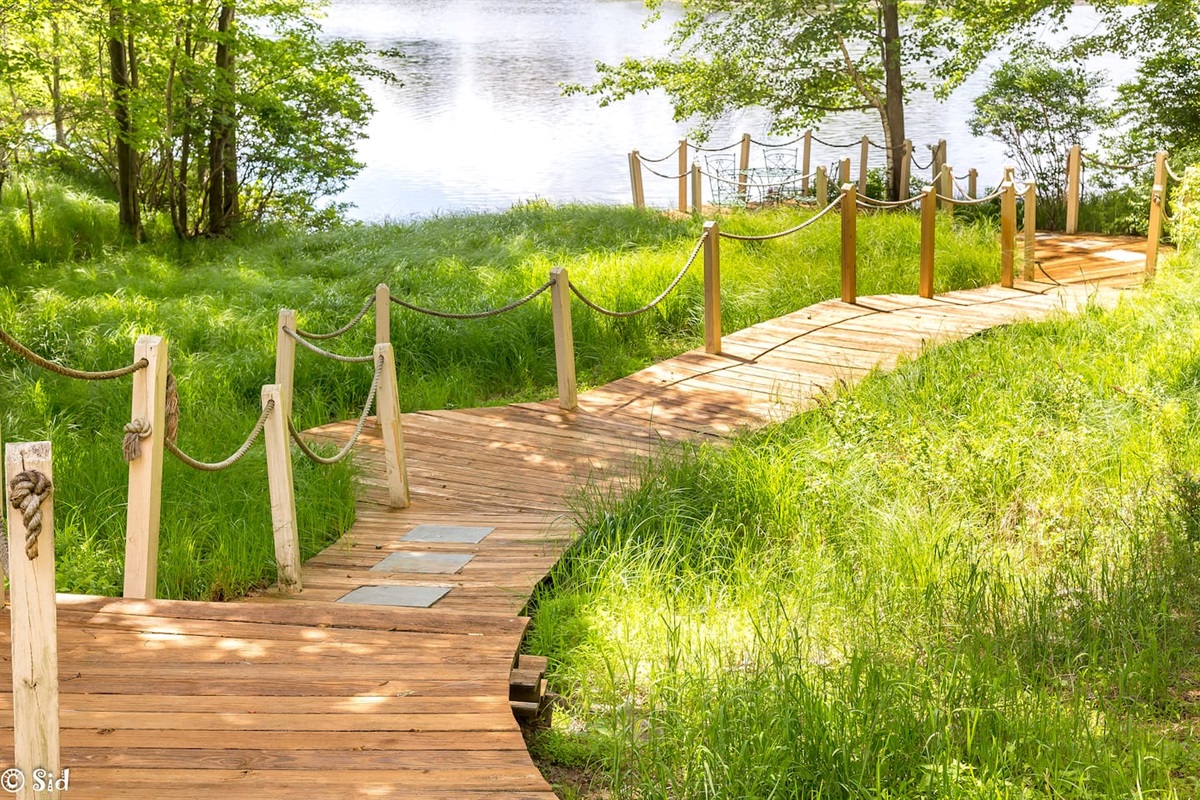Private boardwalk to lake